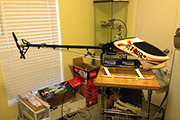 RC Helicopter mounted on board for work stand using landing skid (clips) clamps